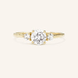 Blushing Bride Round Moissanite Three Stone Engagement Ring