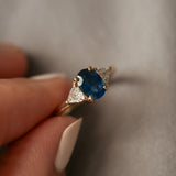 Lux Blue Oval Blue Sapphire Trillion Moissanite Three Stone Engagement Ring