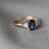 Lux Blue Oval Blue Sapphire Trillion Moissanite Three Stone Engagement Ring