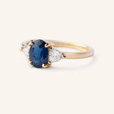 Lux Blue Oval Blue Sapphire Trillion Moissanite Three Stone Engagement Ring