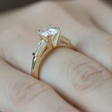 Stately Manor Round Moissanite Tapered Baguette Three Stone Engagement Ring