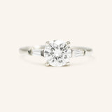 Stately Manor Round Moissanite Tapered Baguette Three Stone Engagement Ring