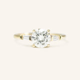 Stately Manor Round Moissanite Tapered Baguette Three Stone Engagement Ring