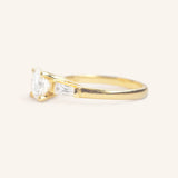 Stately Manor Round Moissanite Tapered Baguette Three Stone Engagement Ring