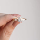 Stately Manor Round Moissanite Tapered Baguette Three Stone Engagement Ring