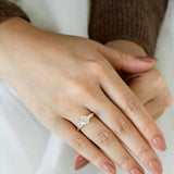 Stately Manor Round Moissanite Tapered Baguette Three Stone Engagement Ring