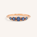 Rose gold Lovett five stone blue sapphire anniversary ring front view on white background