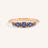 Rose gold Lovett five stone blue sapphire anniversary ring front view on white background