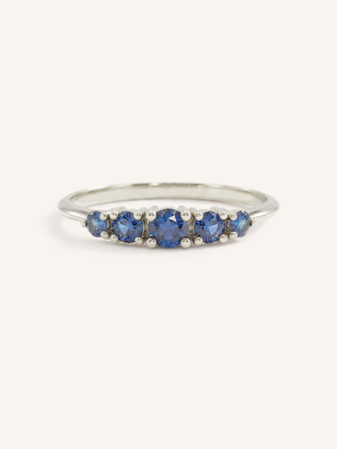 White gold Lovett five stone blue sapphire anniversary ring front view on white background