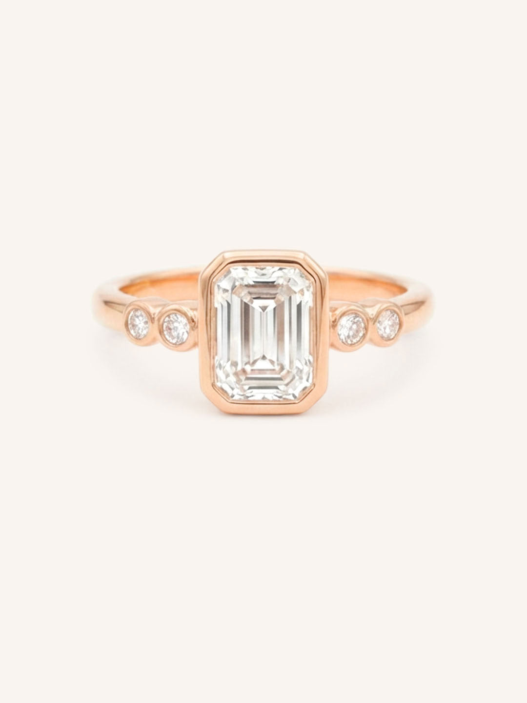 Rose gold Alameda emerald cut bezel set diamond engagement ring front view on white background