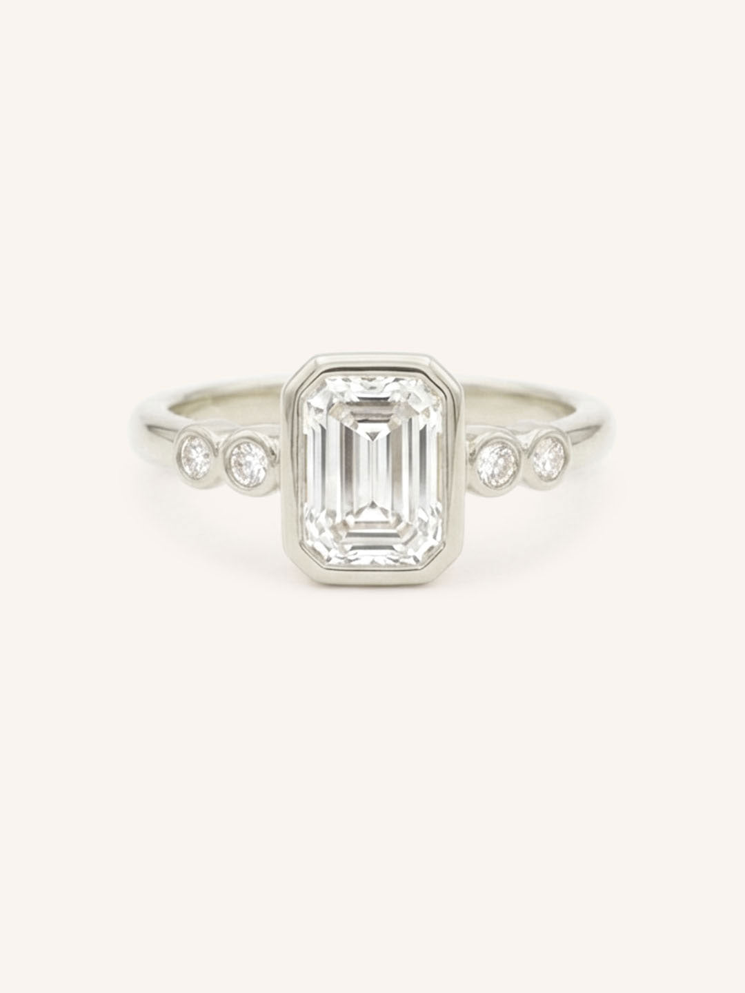 White gold Alameda emerald cut bezel set diamond engagement ring front view on white background