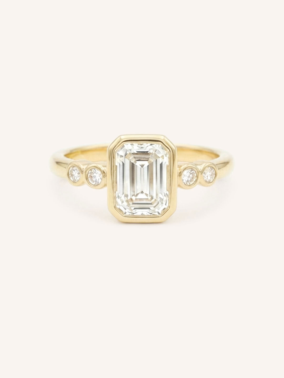 Yellow gold Alameda emerald cut bezel set diamond engagement ring front view on white background