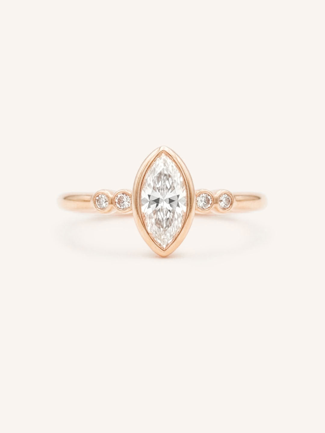 Rose gold Alameda marquise diamond bezel set engagement ring front view on white background