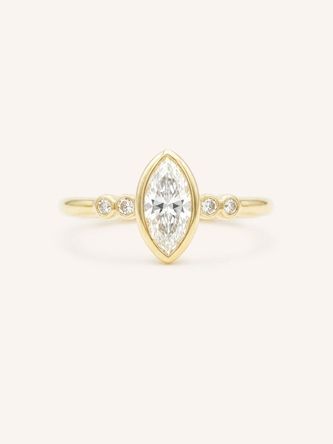 Yellow gold Alameda marquise diamond bezel set engagement ring front view on white background