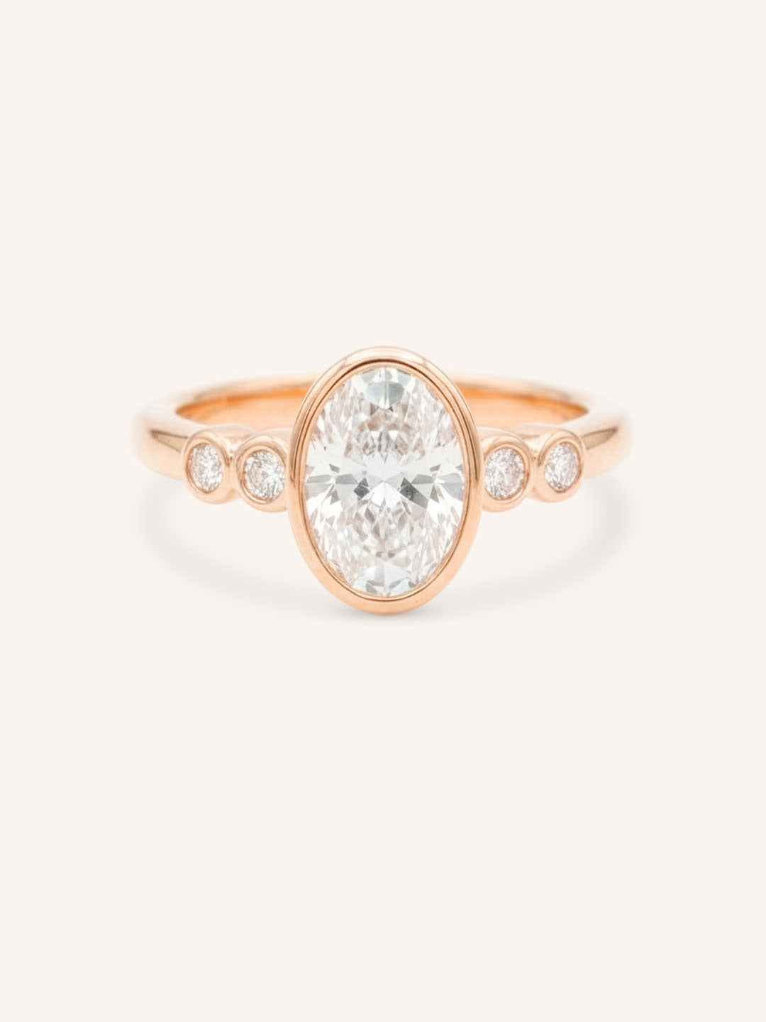 Rose gold Alameda oval bezel set diamond engagement ring front view on white background