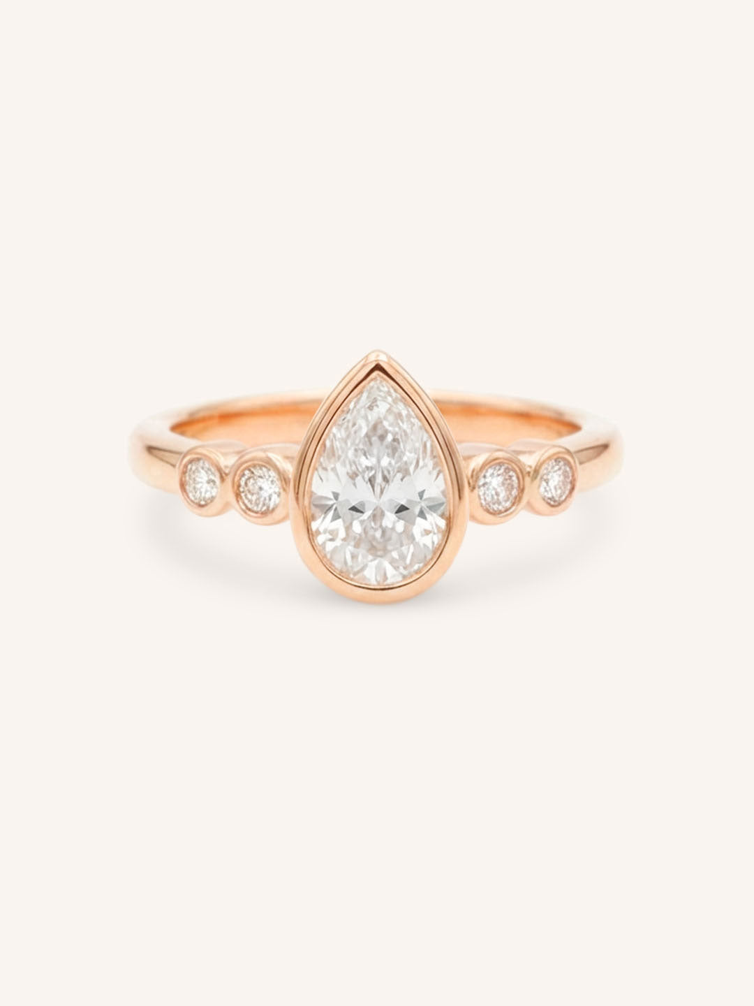Rose gold Alameda pear bezel set diamond engagement ring front view on white background