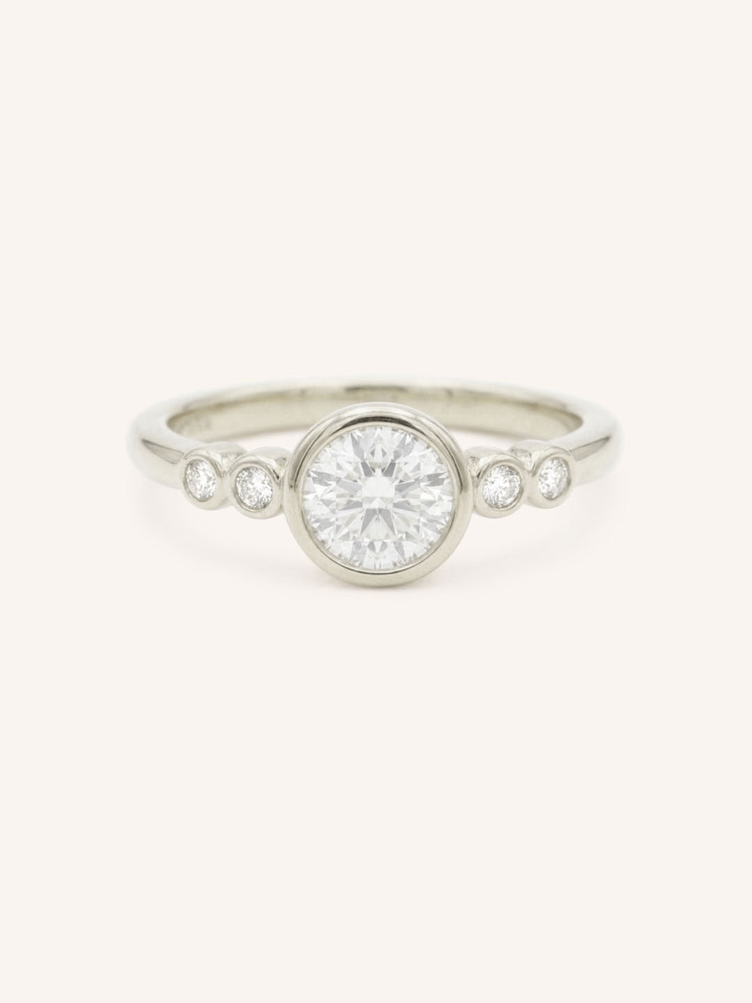 White gold Alameda round diamond bezel set engagement ring front view on white background