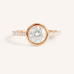 Rose gold round cut bezel set accented diamond engagement ring front view on white background