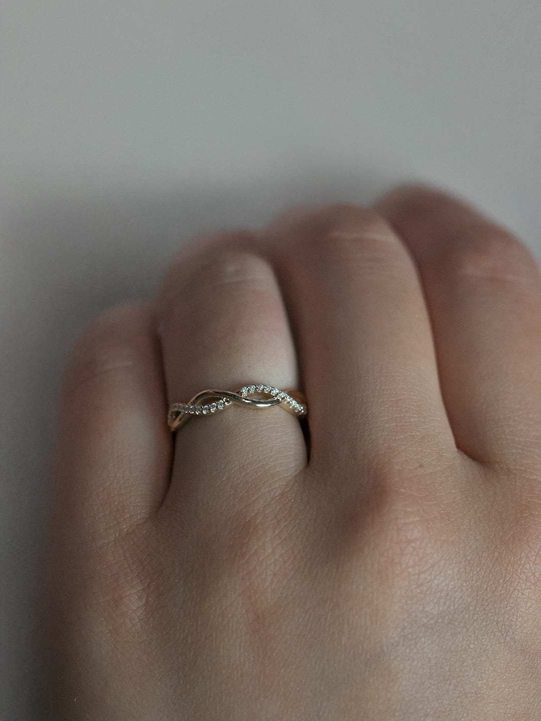 Interwoven Diamond Wedding Ring lifestyle photo worn on hand