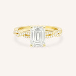 Yellow Gold Levana Emerald Cut Diamond Twist Accented Engagement Ring front view on white background