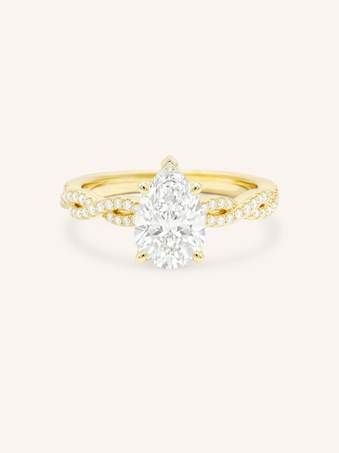 Yellow Gold Levana Pear Diamond Twist Accented Engagement Ring front view on white background