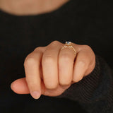 Claire oval diamond halo vintage style engagement ring lifestyle photo worn on hand