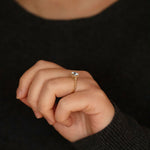 Claire oval diamond halo vintage style engagement ring lifestyle photo worn on hand