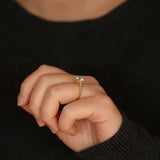 Claire oval diamond halo vintage style engagement ring lifestyle photo worn on hand
