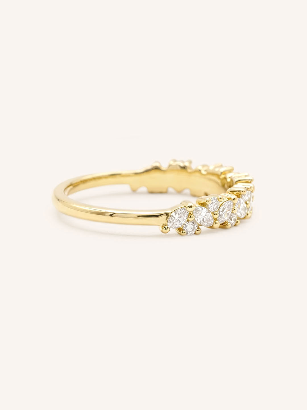 Yellow gold Pennywell diamond anniversary band side view on white background
