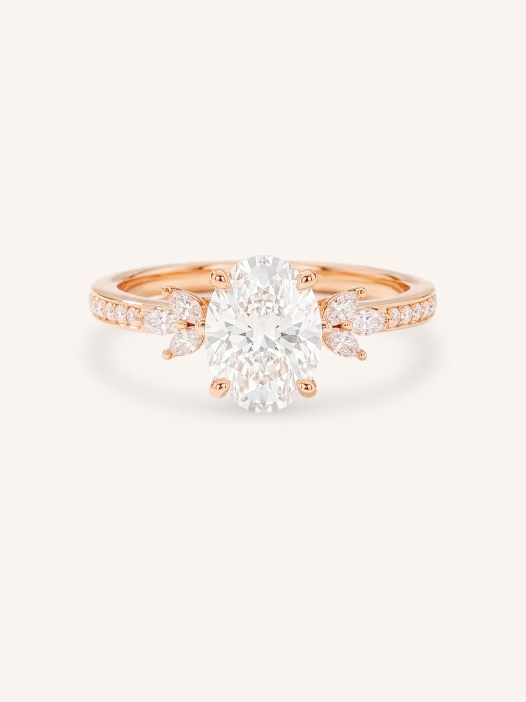 Rose gold oval-cut diamond engagement ring with marquise diamond accents on white background
