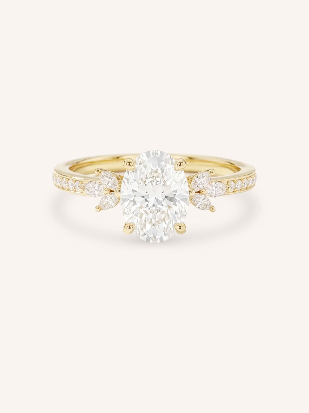 Yellow gold oval-cut diamond engagement ring with marquise diamond accents on white background