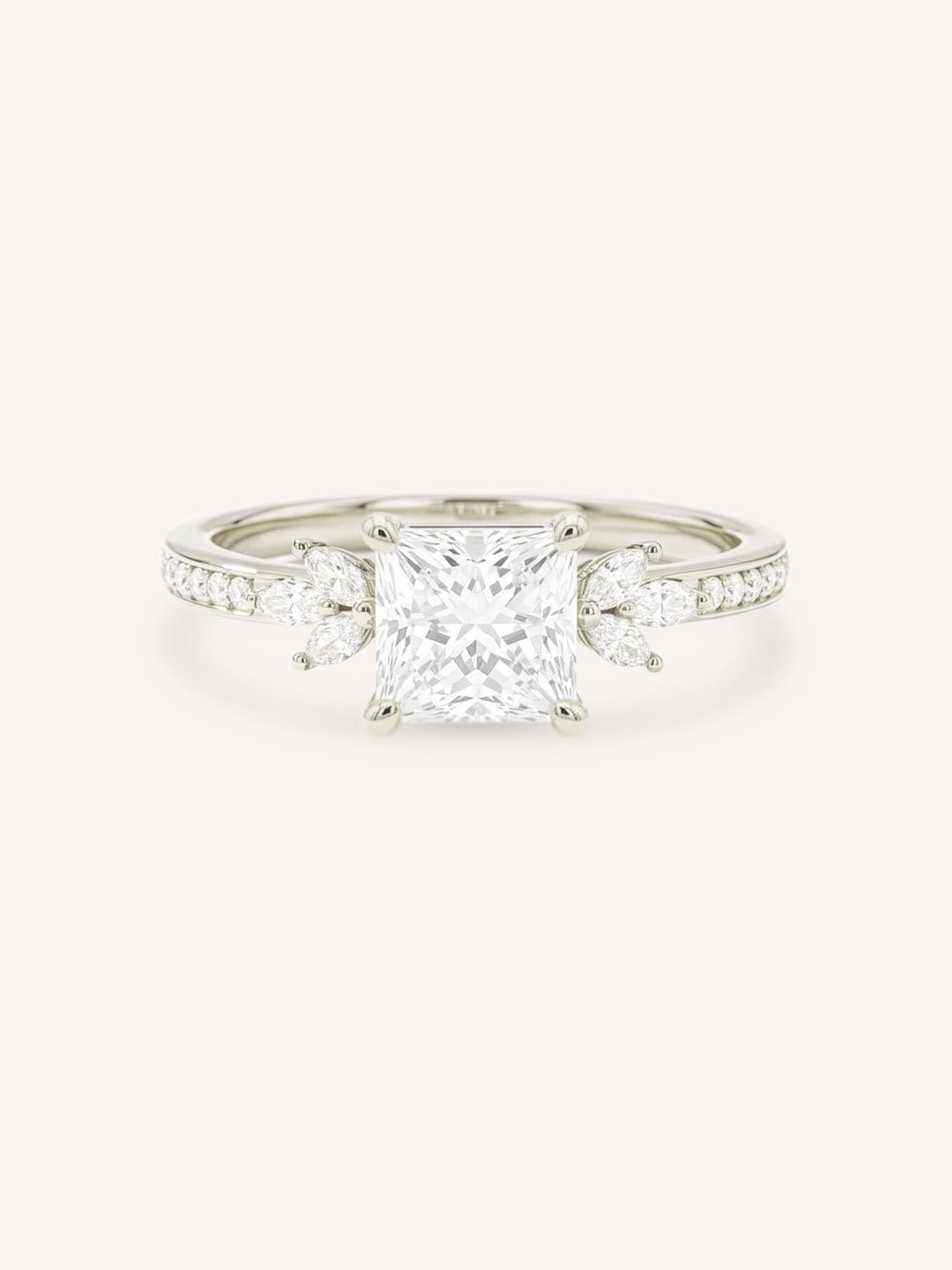 White gold princess-cut diamond engagement ring with marquise diamond accents on white background