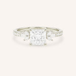 White gold princess-cut diamond engagement ring with marquise diamond accents on white background