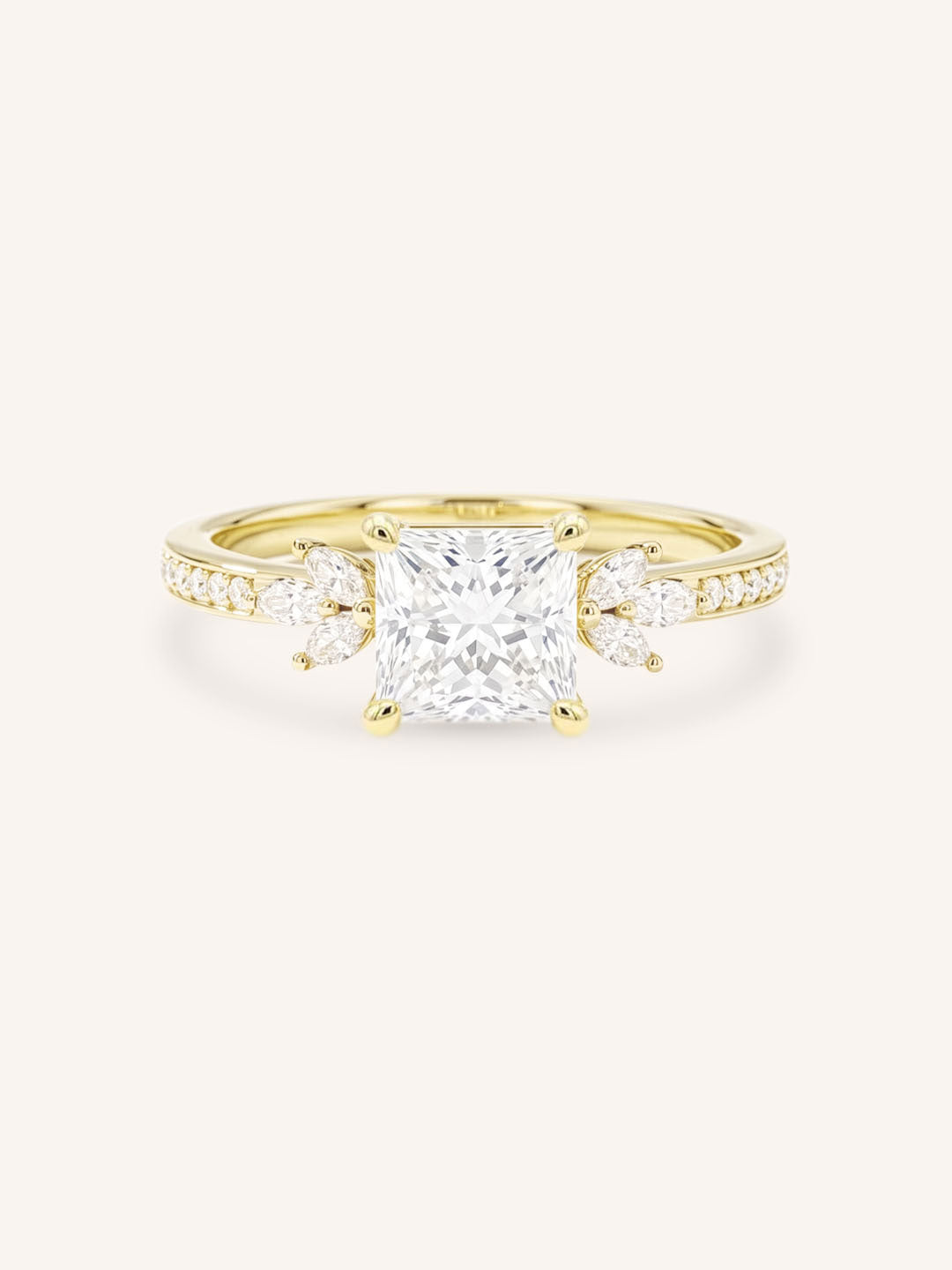Yellow gold princess-cut diamond engagement ring with marquise diamond accents on white background