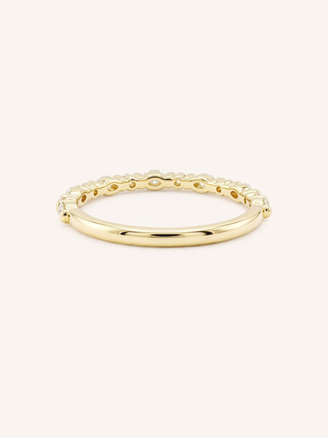 Yellow gold diamond eternity wedding band back view on white background