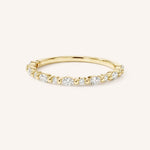 Yellow gold alternating round and marquise-cut diamond eternity wedding band front view on white background