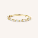 Yellow gold alternating round and marquise-cut diamond eternity wedding band front view on white background