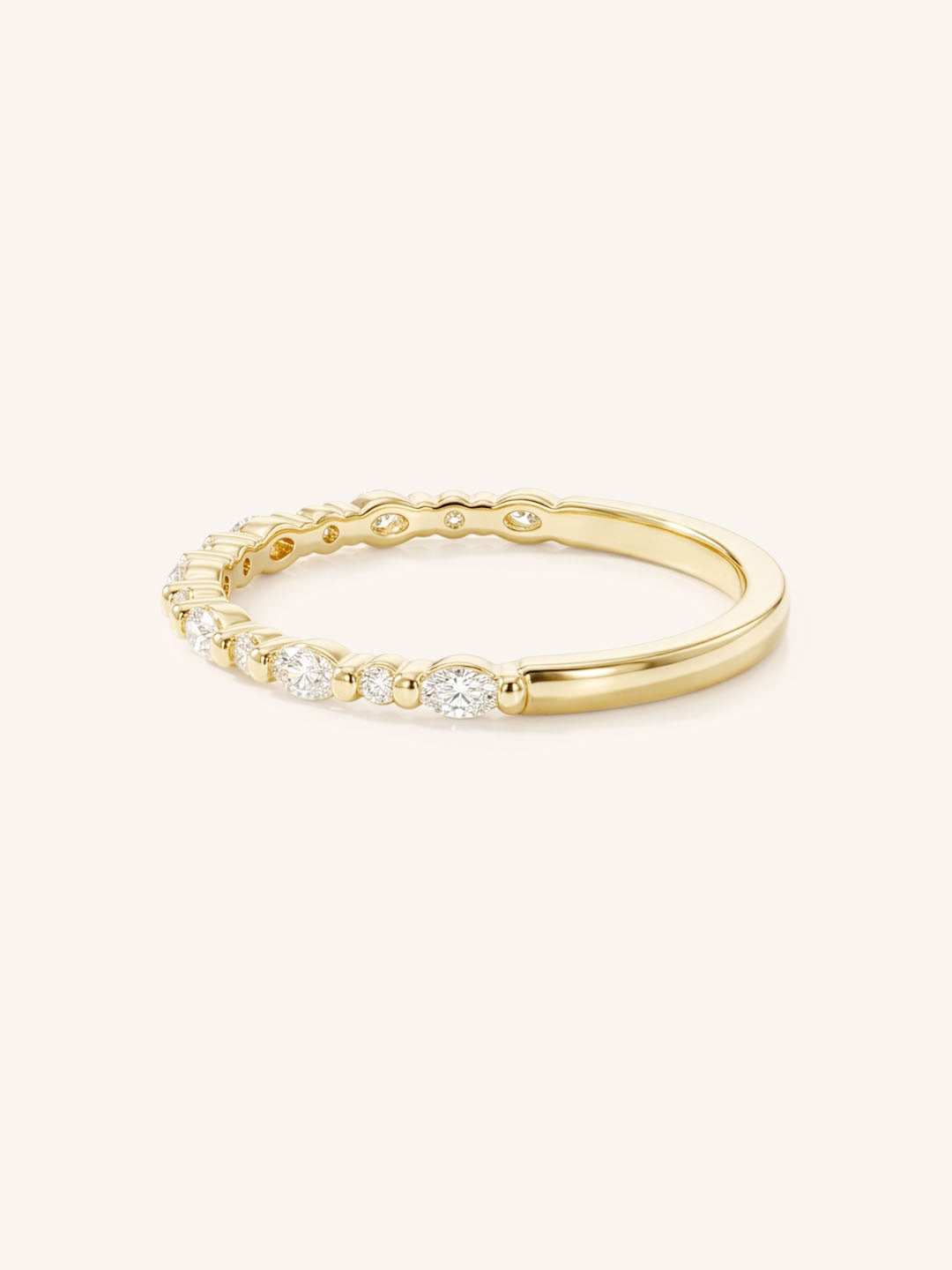 Yellow gold diamond eternity wedding band side view on white background
