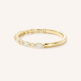 Yellow gold diamond eternity wedding band side view on white background