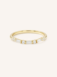 Yellow gold eternity wedding band with alternating baguette and round diamonds, full band view, on white background