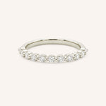 White gold round diamond eternity wedding band on white background