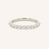 White gold round diamond eternity wedding band on white background