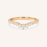 Rose gold ring with diamonds on a white background