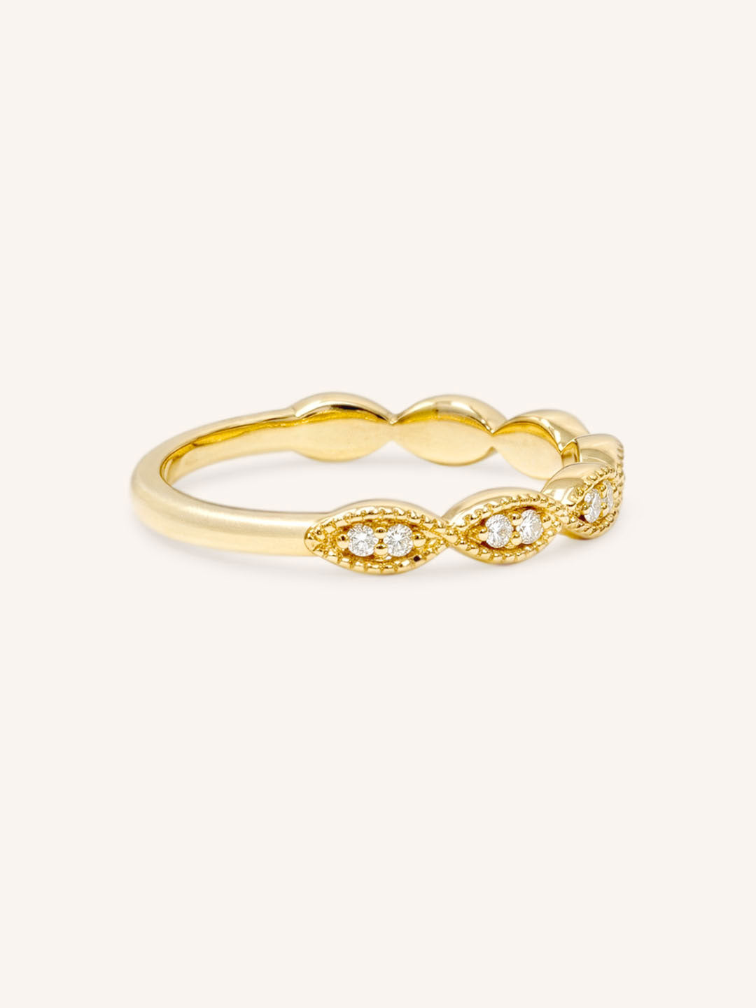 Yellow gold Loubet milgrain diamond wedding band side view on white background
