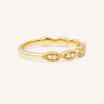 Yellow gold Loubet milgrain diamond wedding band side view on white background
