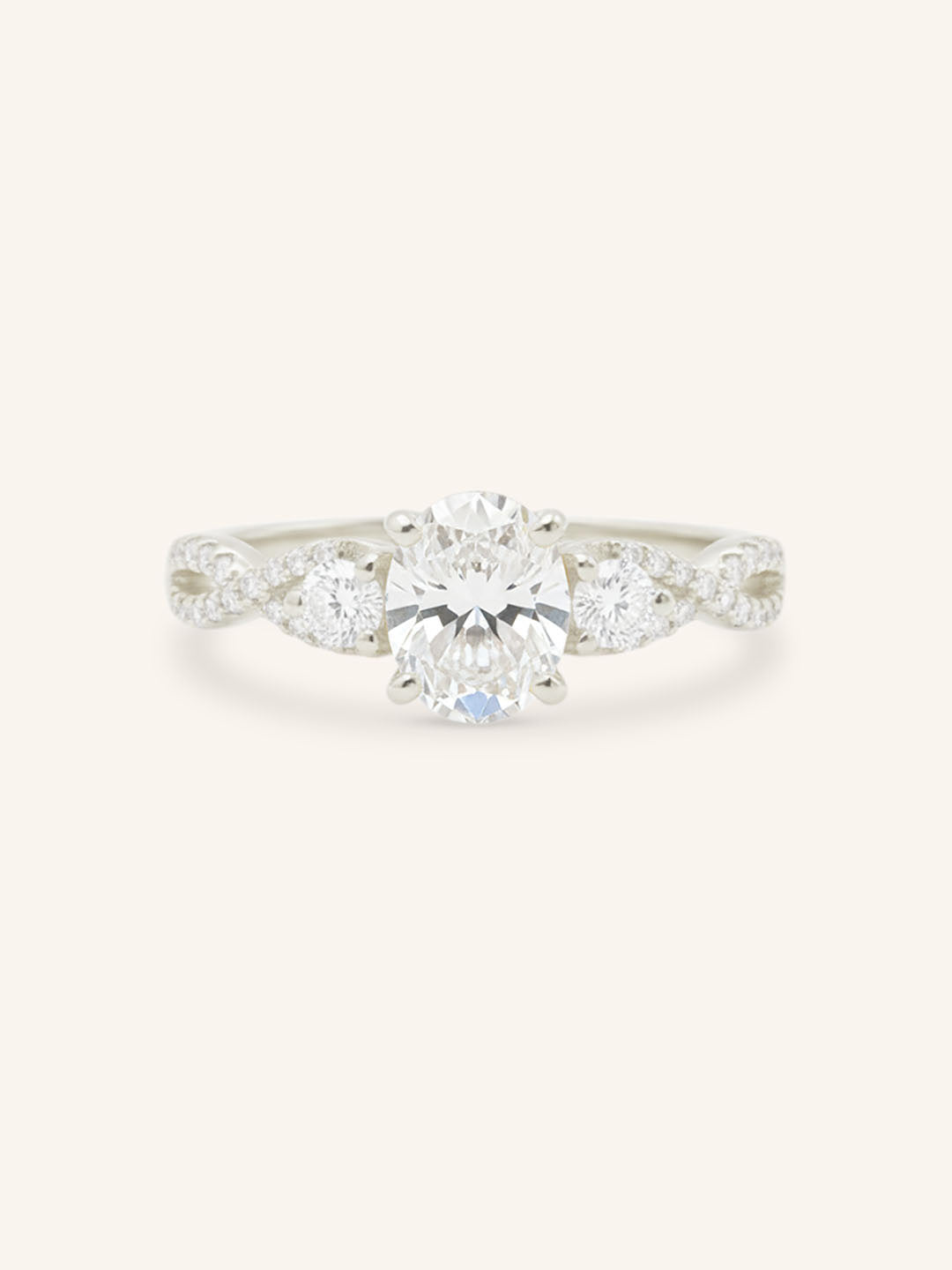 White gold Lindey oval three stone diamond engagement ring front view on white background