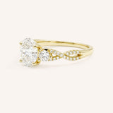 Yellow gold three-stone engagement ring with oval-cut center diamond and twisted pave diamond shank, side view, on white background