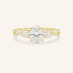 Yellow gold Lindey oval three stone diamond engagement ring front view on white background