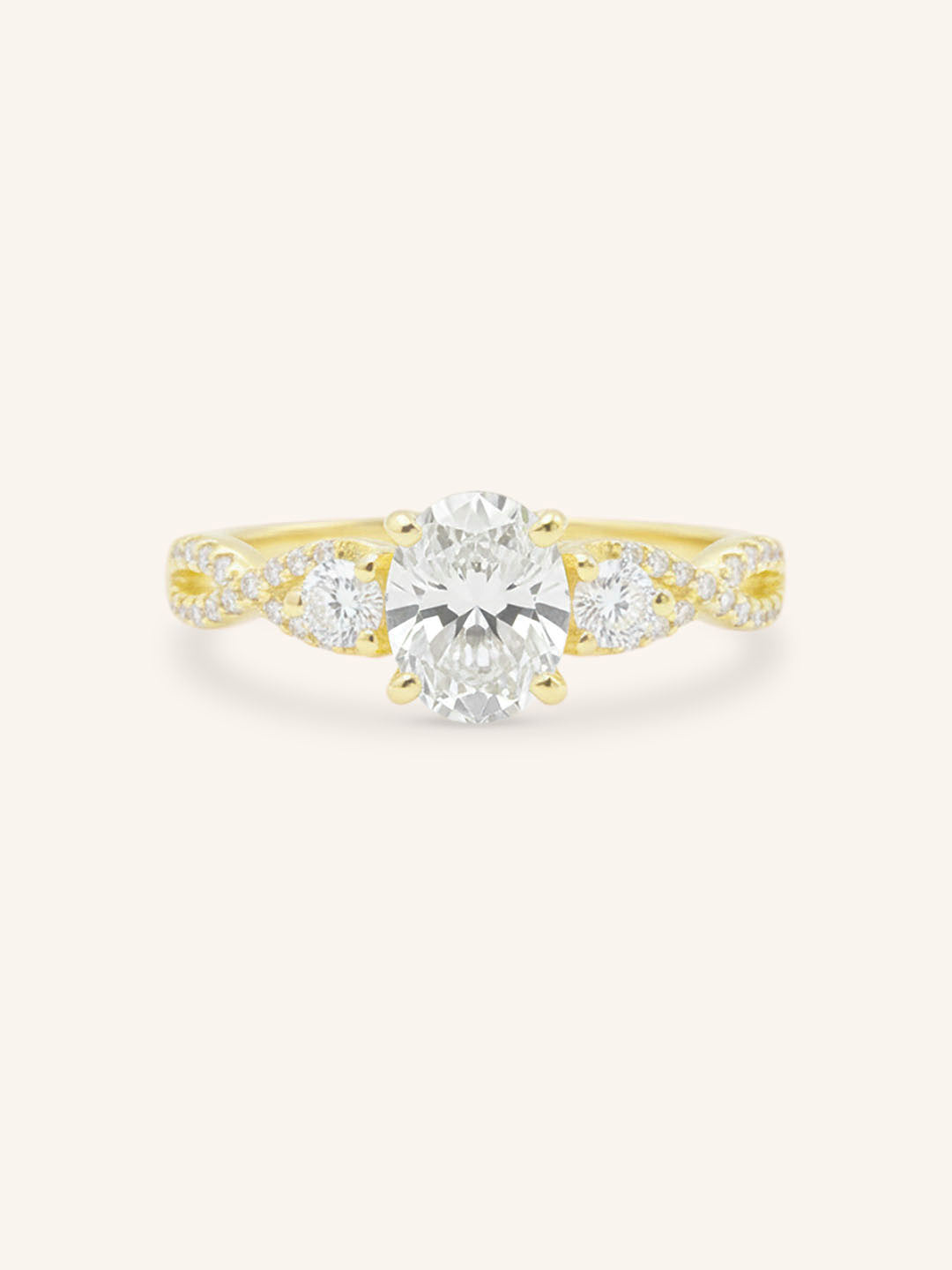 Yellow gold Lindey oval three stone diamond engagement ring front view on white background