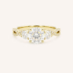 Yellow gold three-stone engagement ring with round-cut center diamond, round side diamonds, and twisted pave diamond shank, front view, on white background